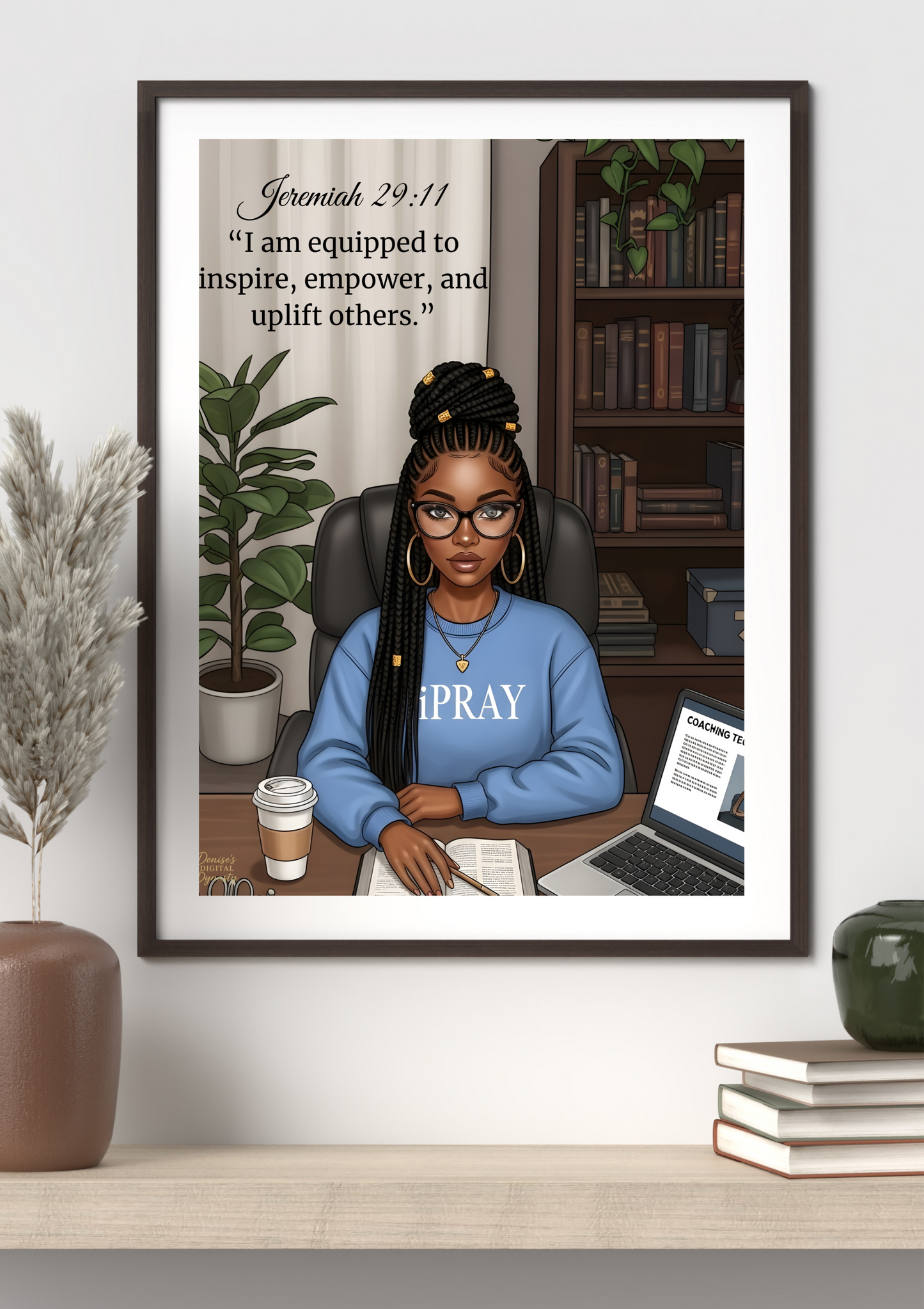Framed artwork of a woman sitting at a desk with motivational quote, placed on a shelf.