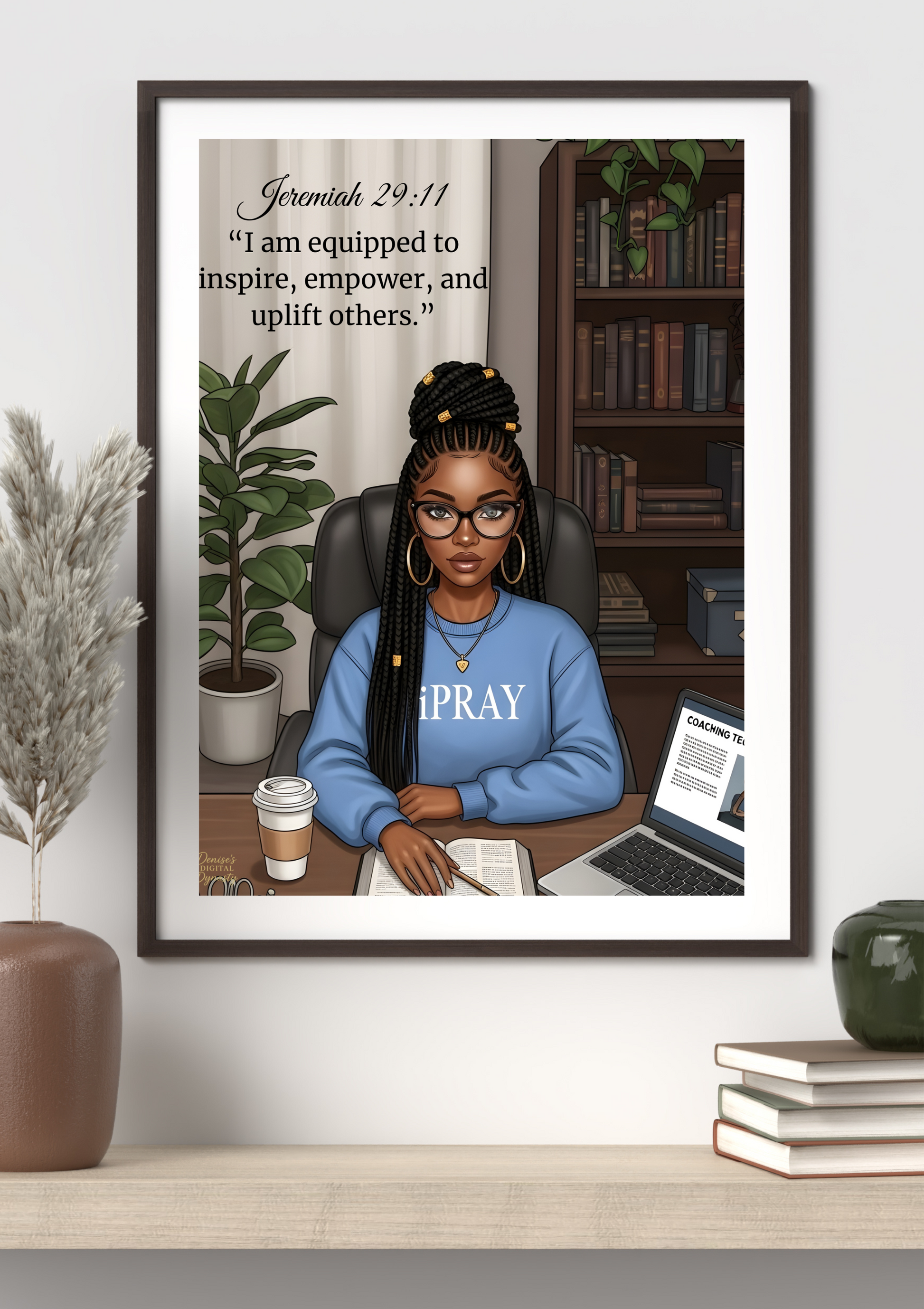 Framed artwork of a woman sitting at a desk with motivational quote, placed on a shelf.