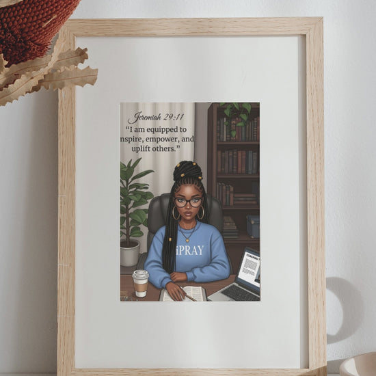 A Video Framed artwork of a woman in a blue shirt with 'PRAY' on it, displayed in a living room.