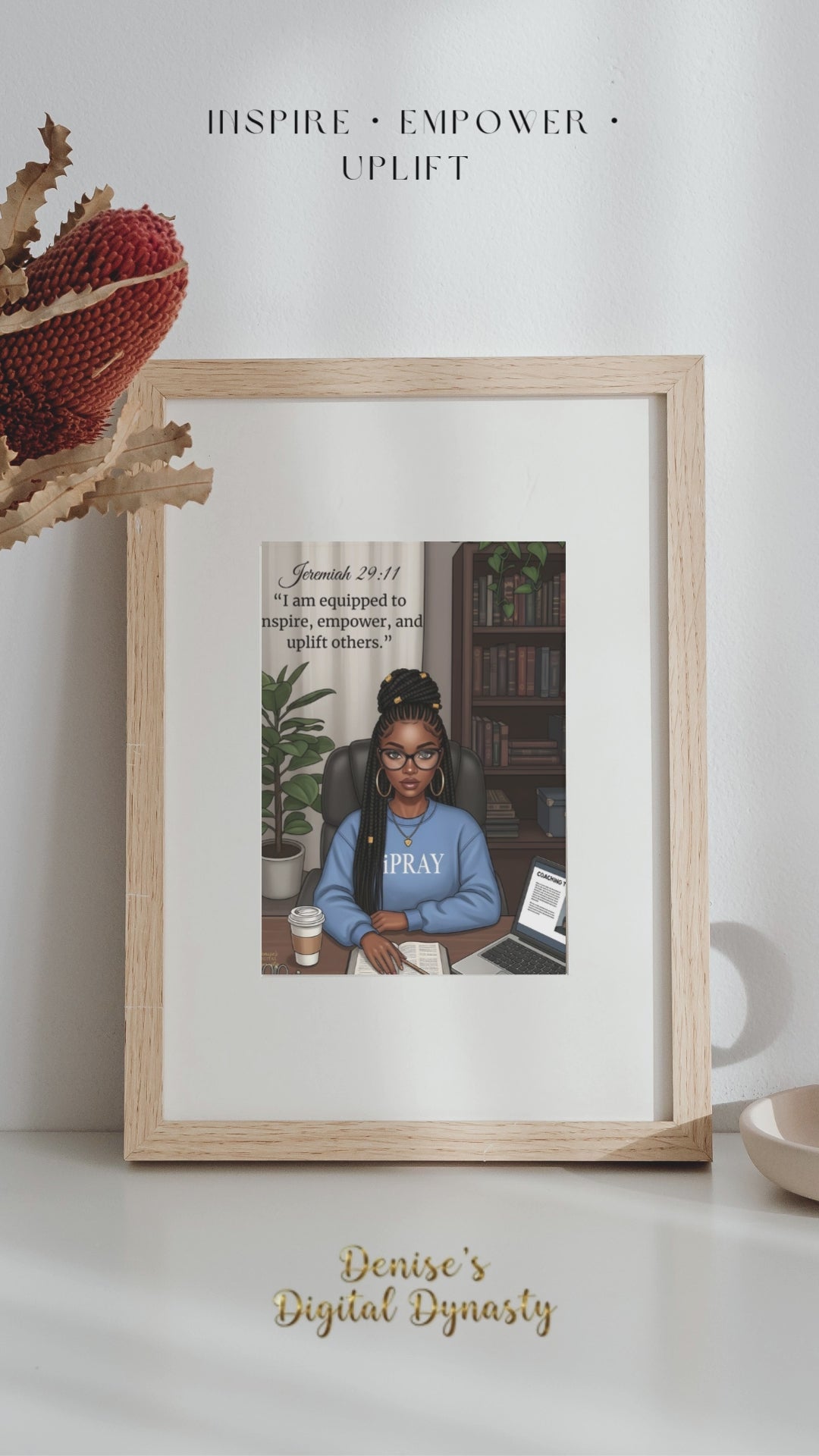 A Video Framed artwork of a woman in a blue shirt with 'PRAY' on it, displayed in a living room.